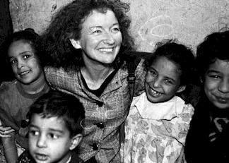 Kathy Kelly with children in Iraq